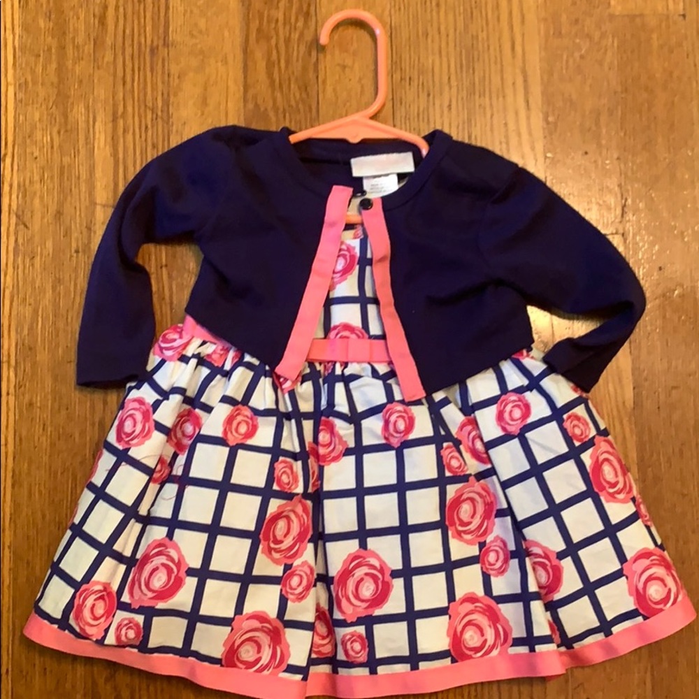Infant dress with matching sweater.